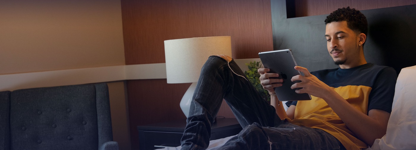 Patient at Sunrise Detox Fairfax reading on his bed